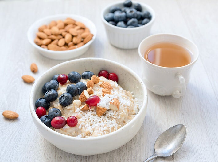 Antioxidants - Small cups with fruit and nuts and a cup of tea.