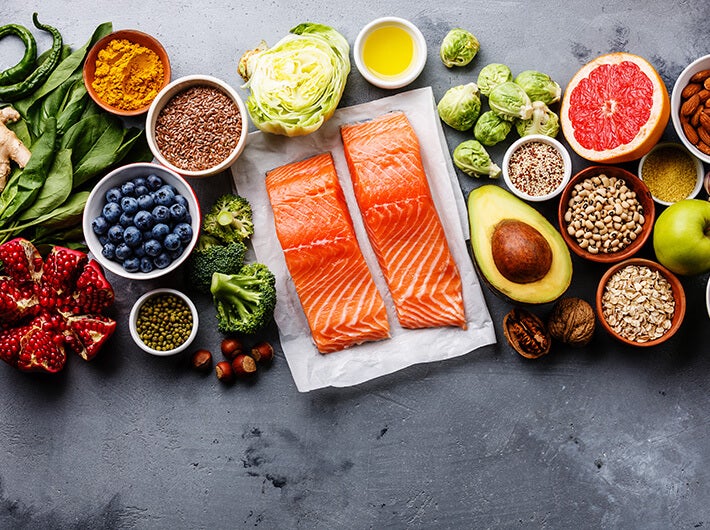 Essential Fatty Acids - A selection of various food products such as fruit, salmon and vegetables.